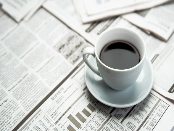 coffee on newspapers - carpetilenet